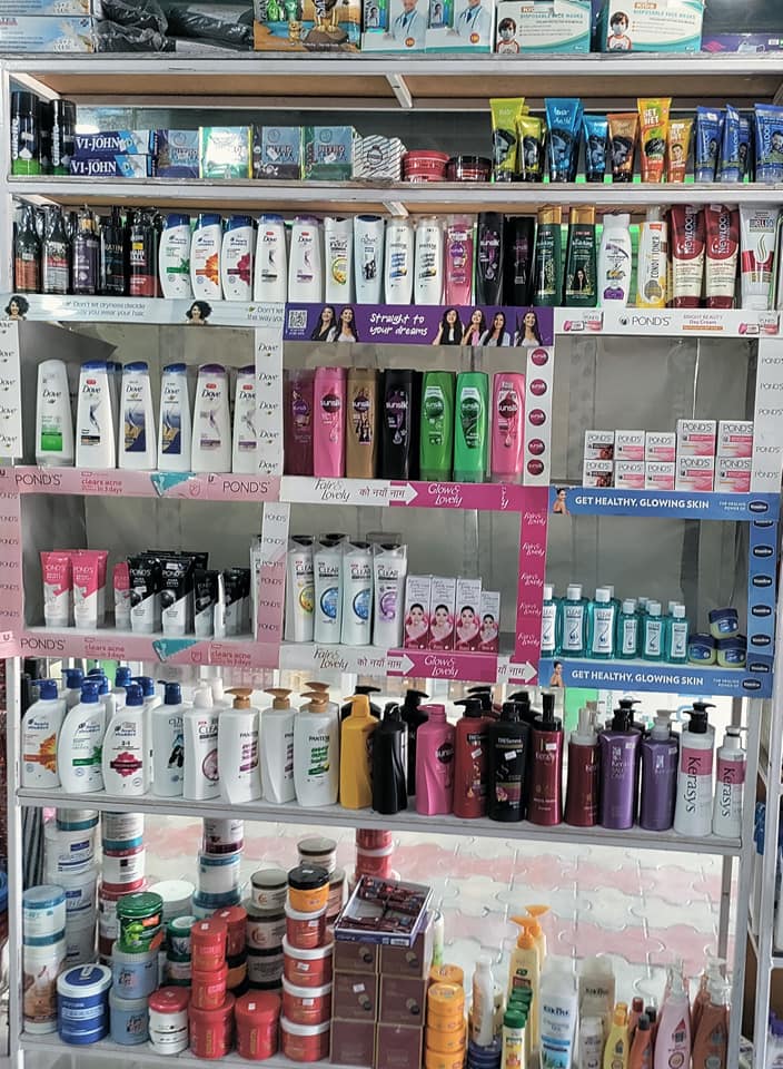 Shelves stocked with a variety of cosmetic products